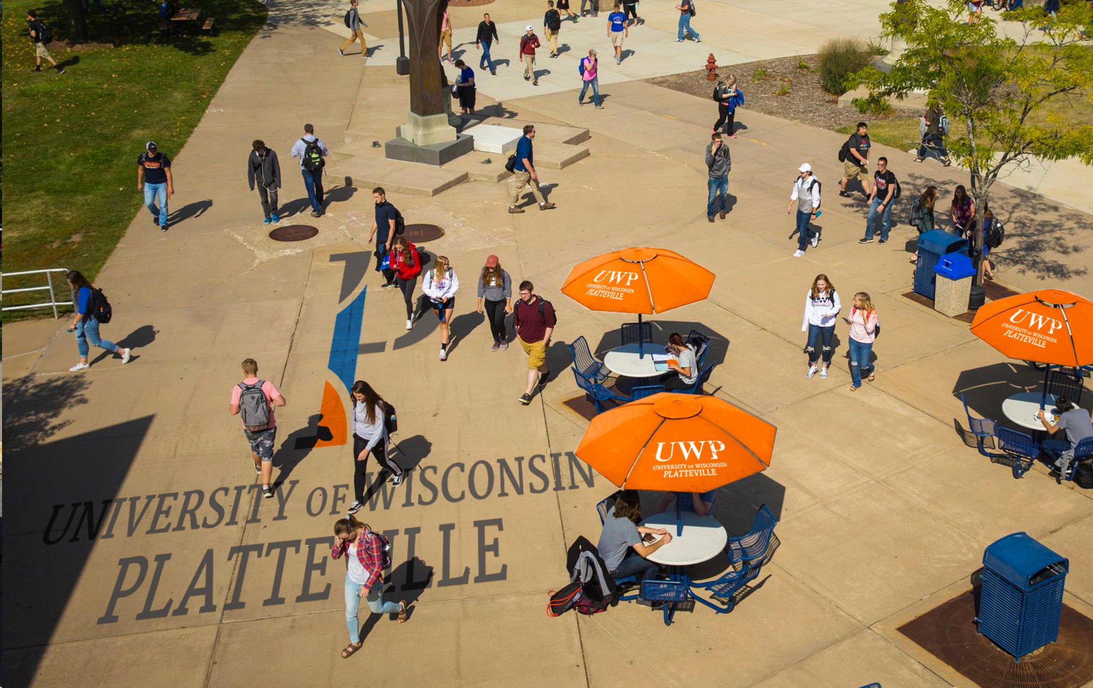 The University of Wisconsin-Platteville campus walkway displaying the Vendi-created P logo on the sidewalk and on table umbrellas
