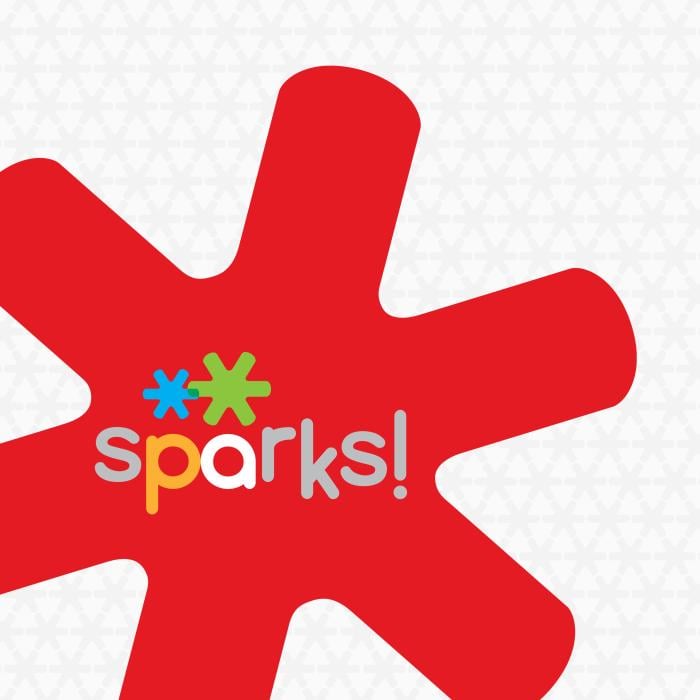 The sparks! four-color brand logo inside a six-pronged red starburst