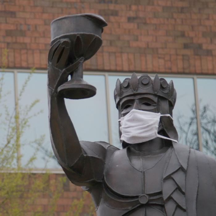 Statue of King Gambrinus wearing a mask. Still image from City of La Crosse COVID-19 PSA video.