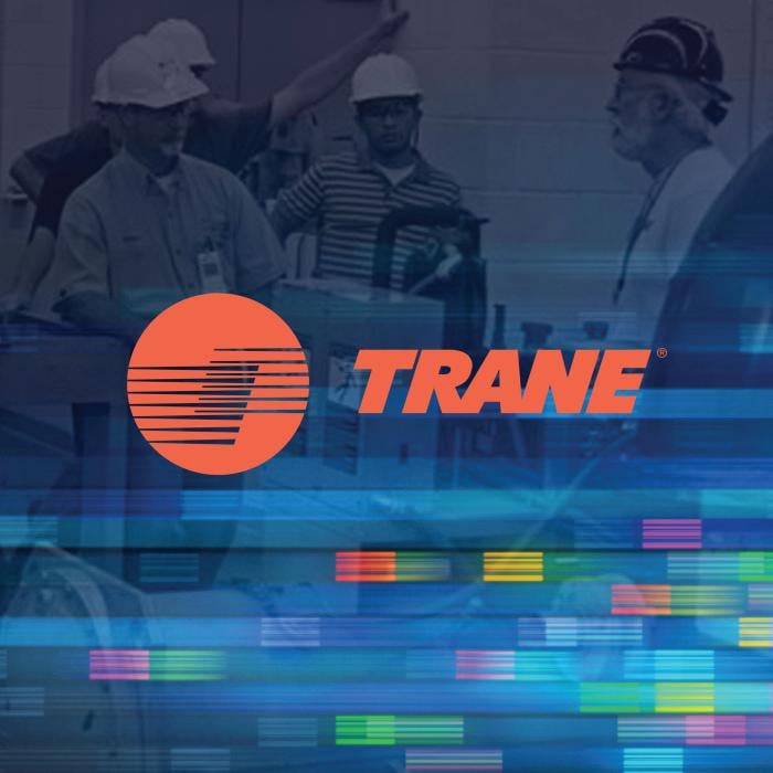 Orange Trane company logo centered atop a faded picture of employees that blends into multi-color blocks inspired by the logo
