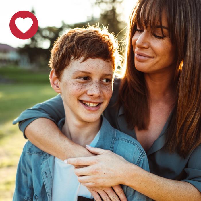 mother and son with heart graphic