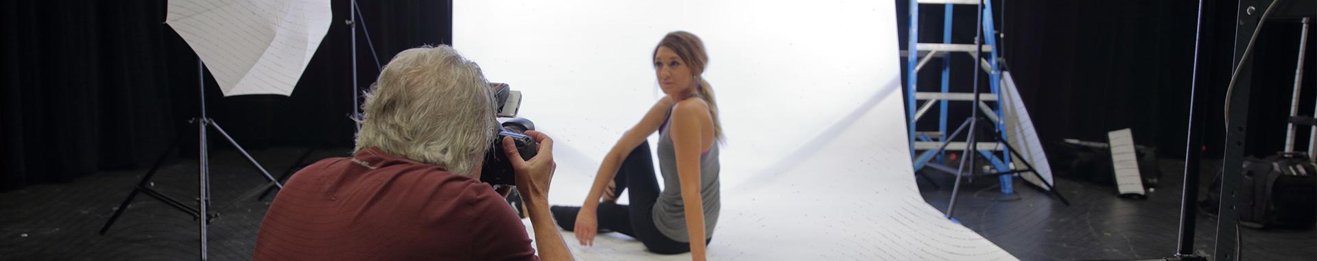 Vendi photographer Kevin Cram at a photo shoot, photographing a female model.