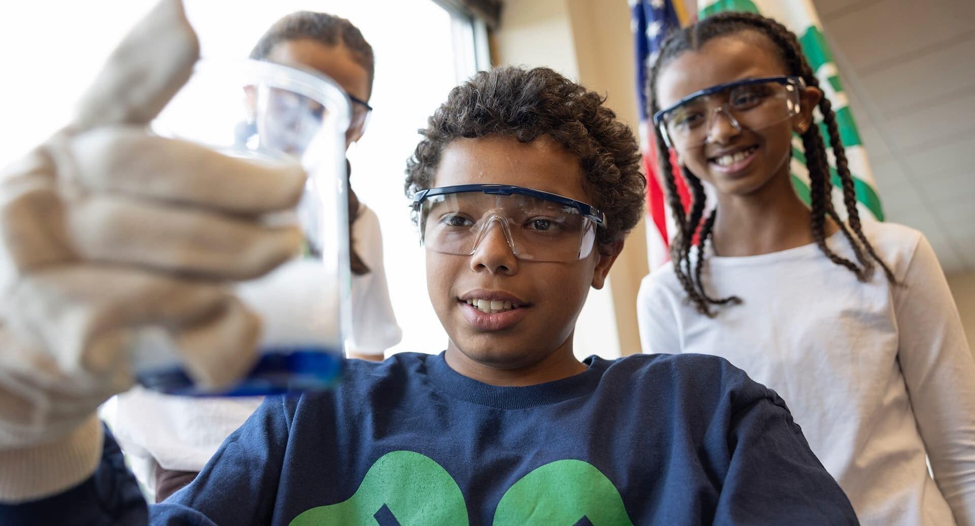 Three children working in a lab together